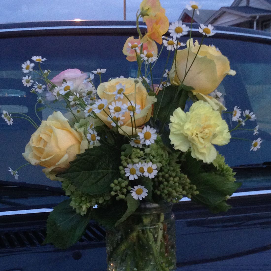close-up of flower arrangement on back of car